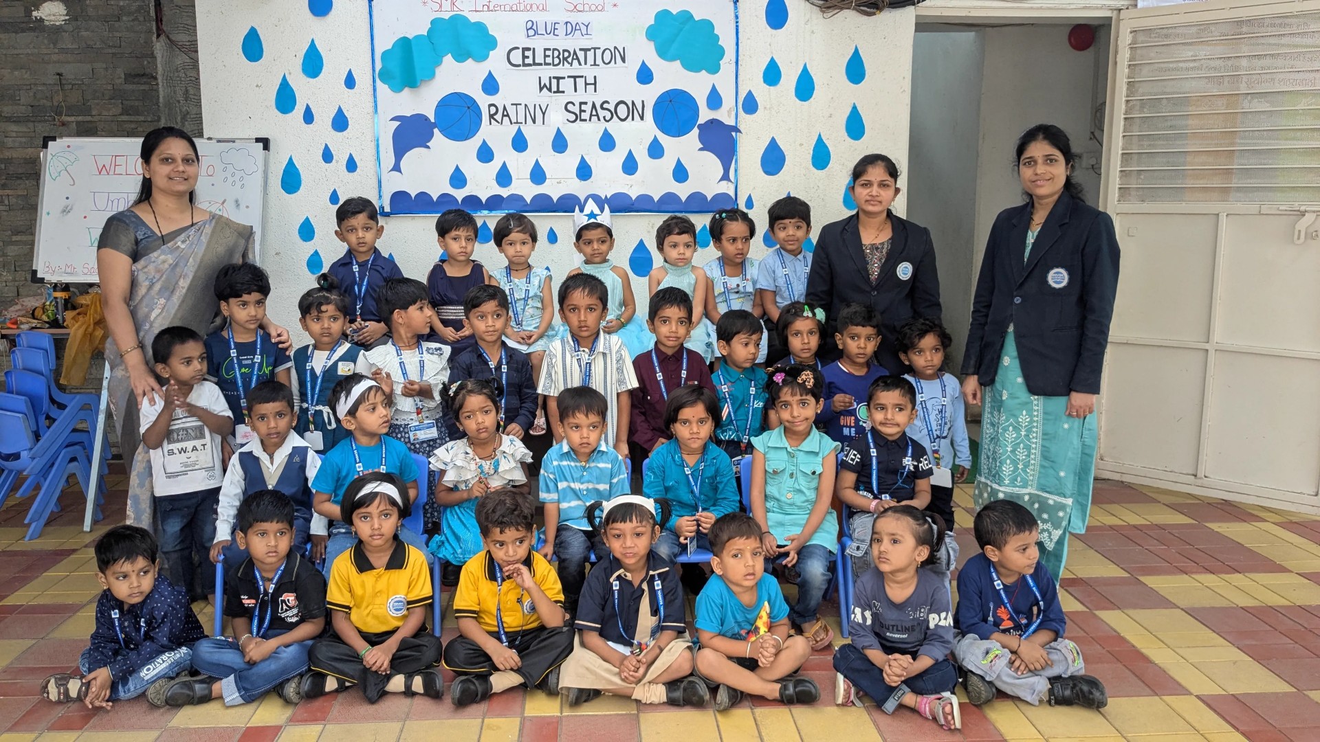 Students engaging in art activities during Blue Day celebrations.